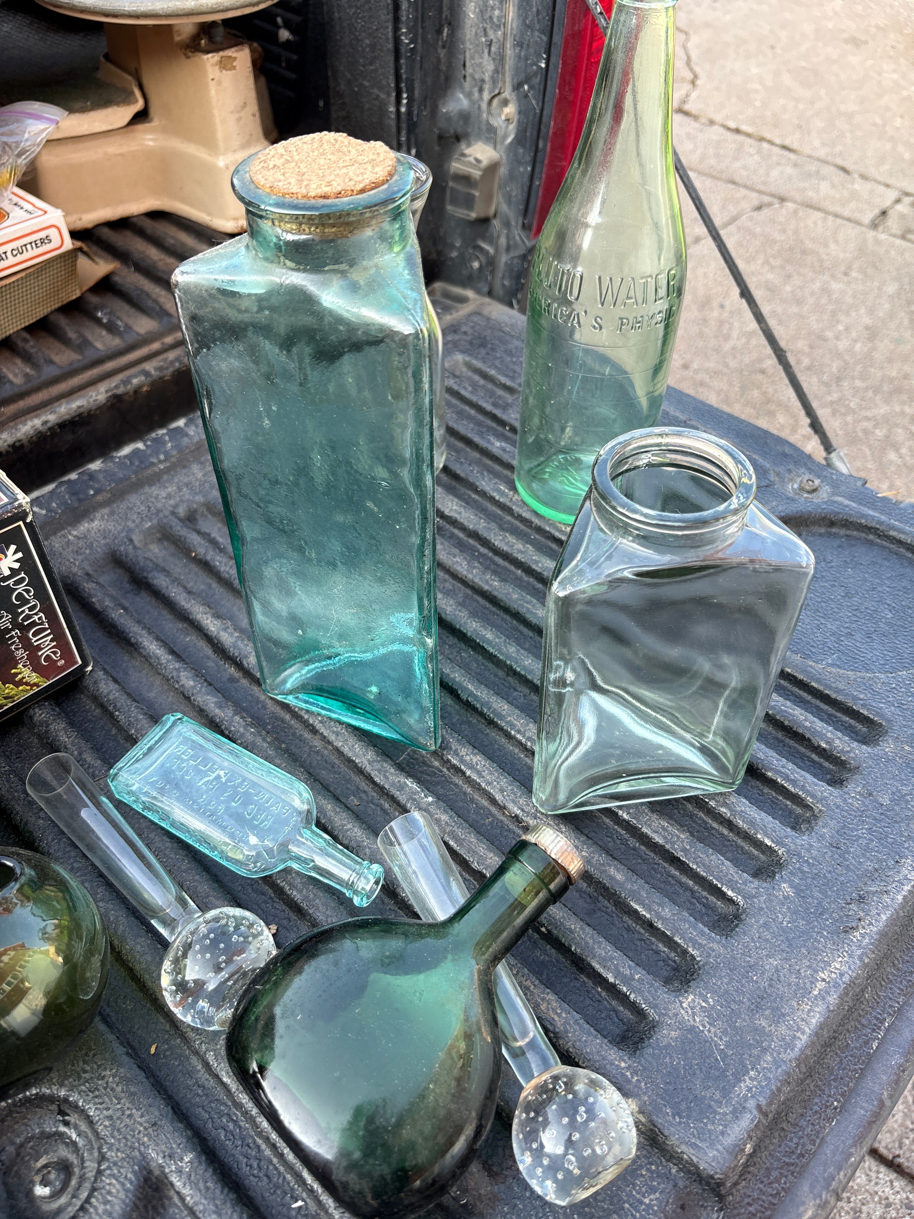 Assorted Glass Bottles and Stoppers