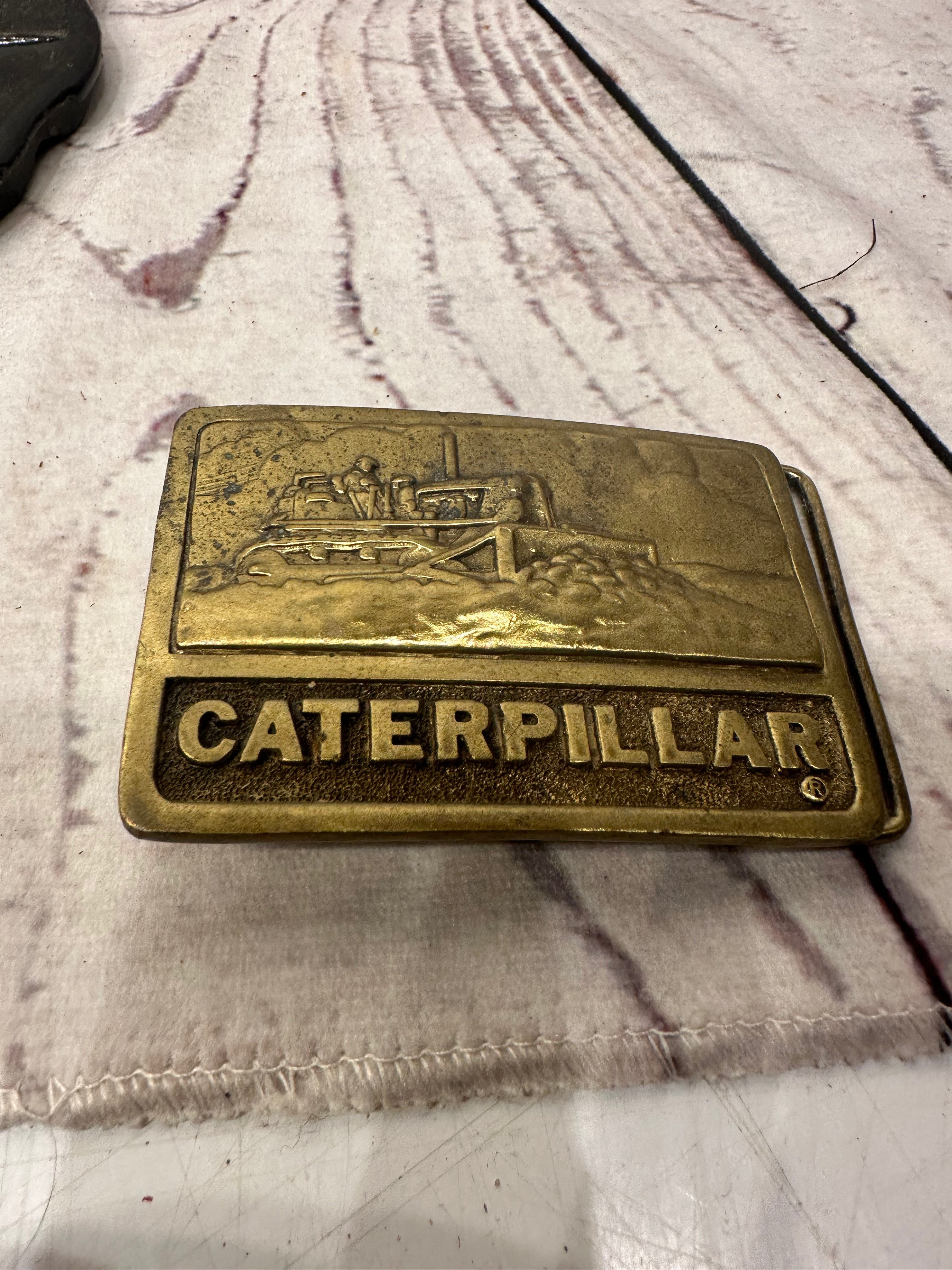 Caterpillar belt buckel