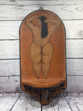 Nude women hanging shelf