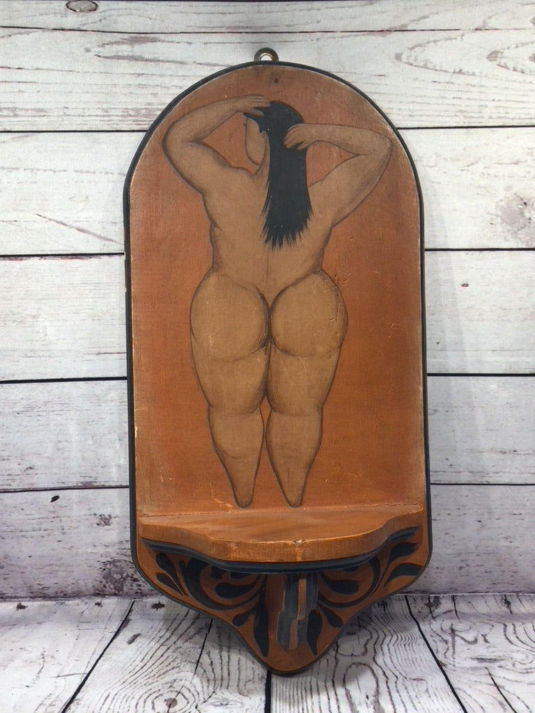 Nude women hanging shelf