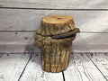 Wood stump with horse shoe