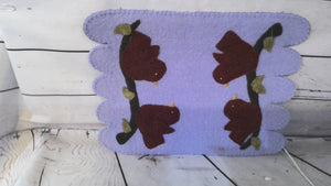 Crocheted bird candle mat