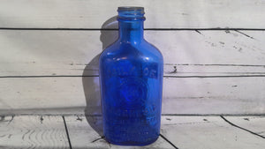 Vintage blue milk of magnesia bottle