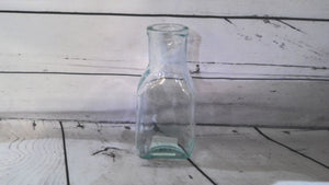 Small glass bottle