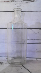 Large glass bottle with measurements