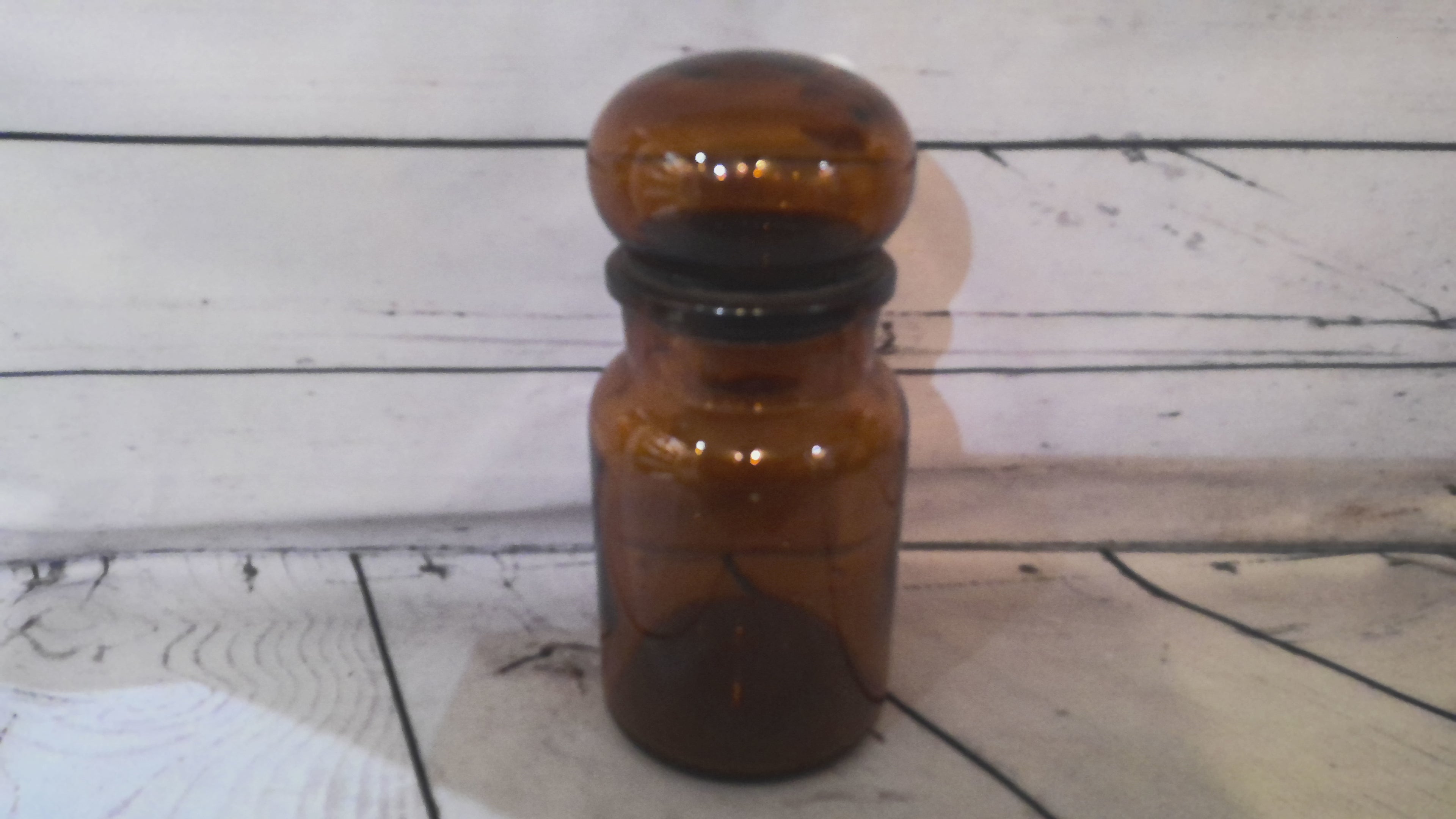Brown glass jar with round lid