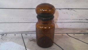 Brown glass jar with round lid