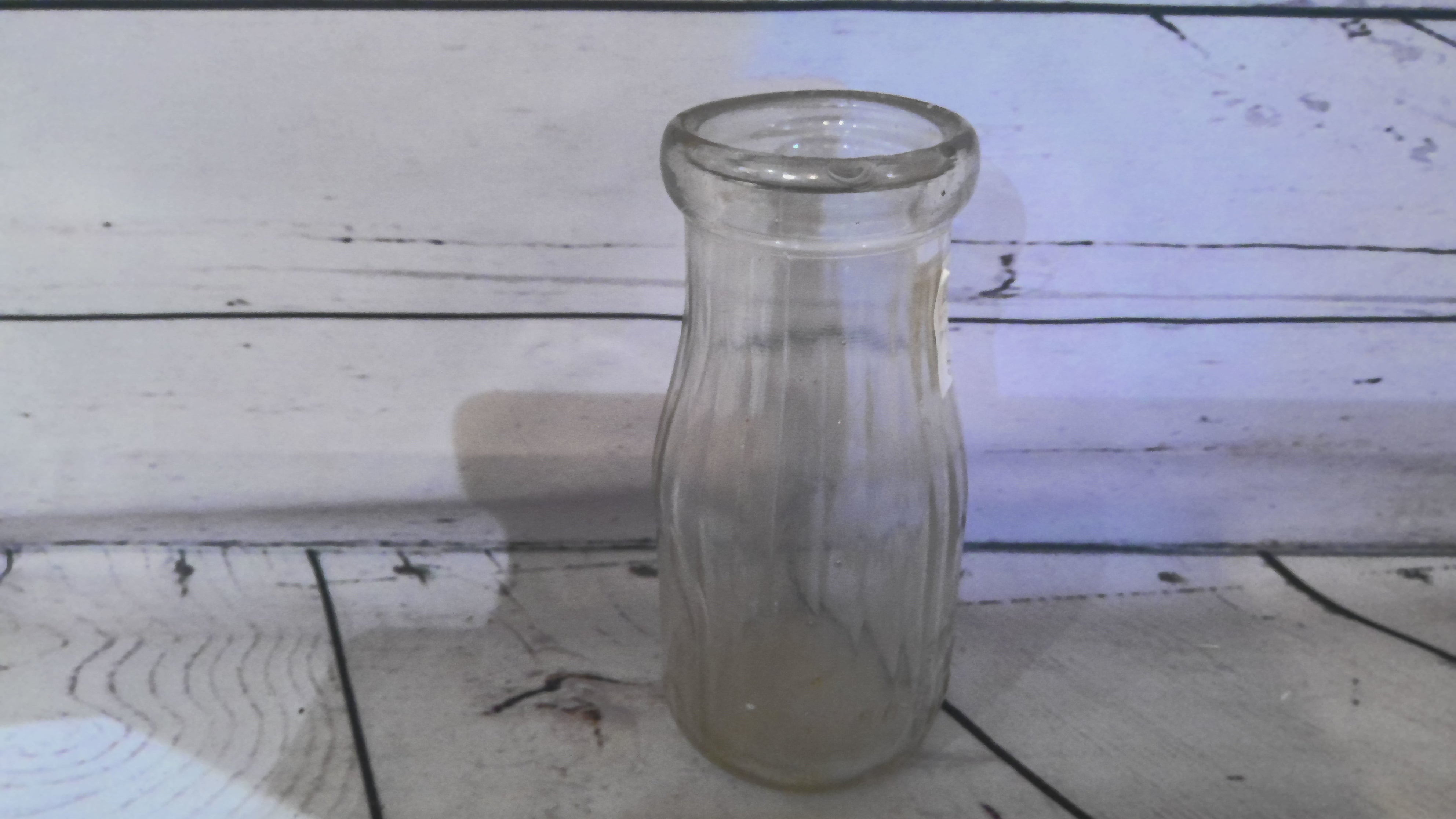 Small glass milk bottle