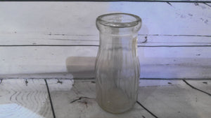Small glass milk bottle