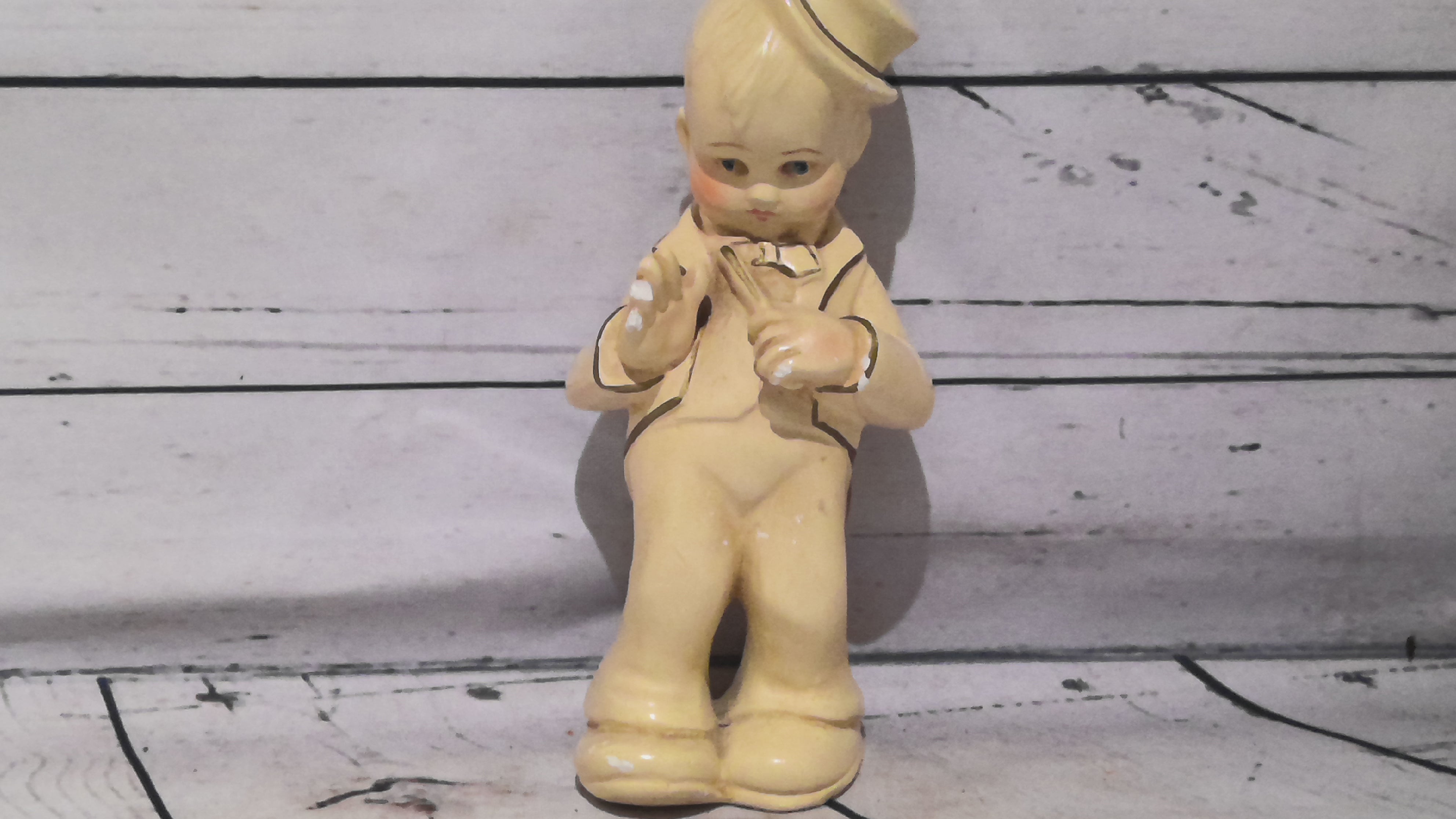 Porcelain sculpture of a boy
