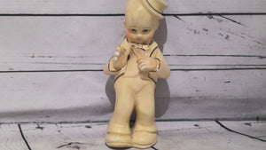 Porcelain sculpture of a boy