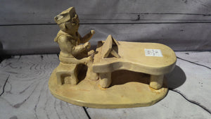 Porcelain guy with piano