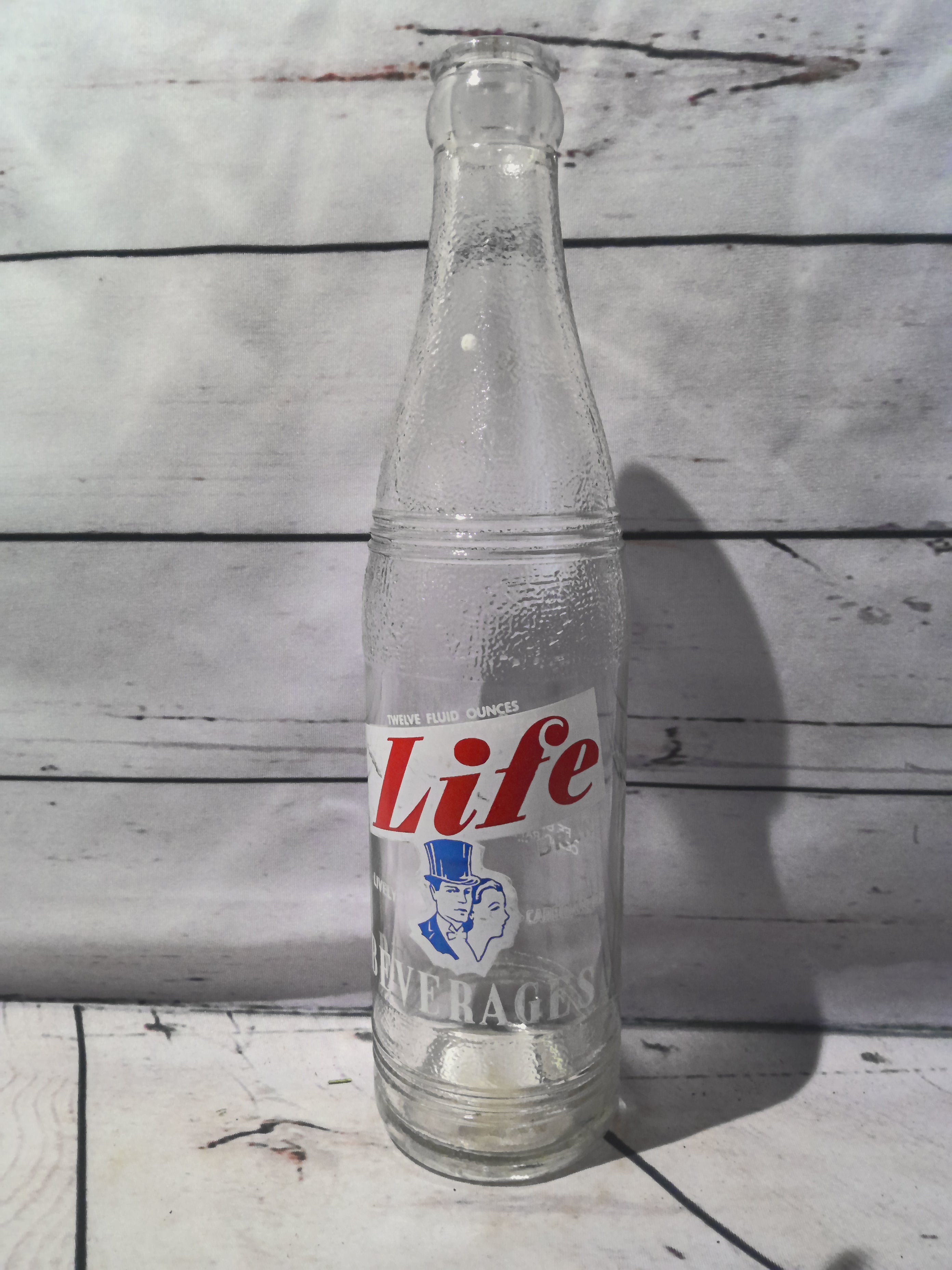 "Life" brand soda bottle