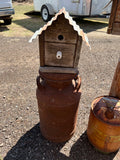 Handmade birdhouse with milk can
