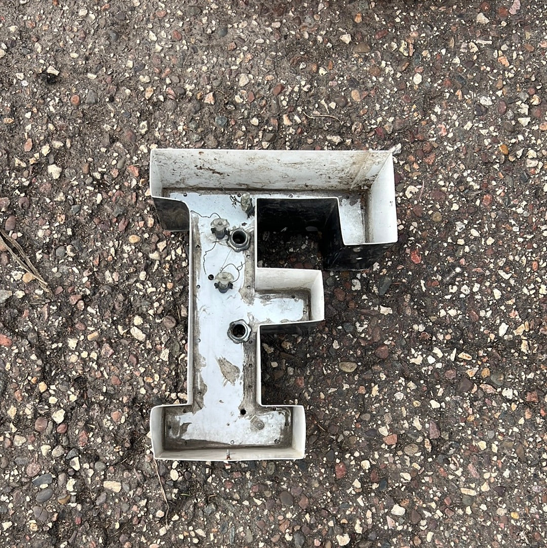 Metal “F”