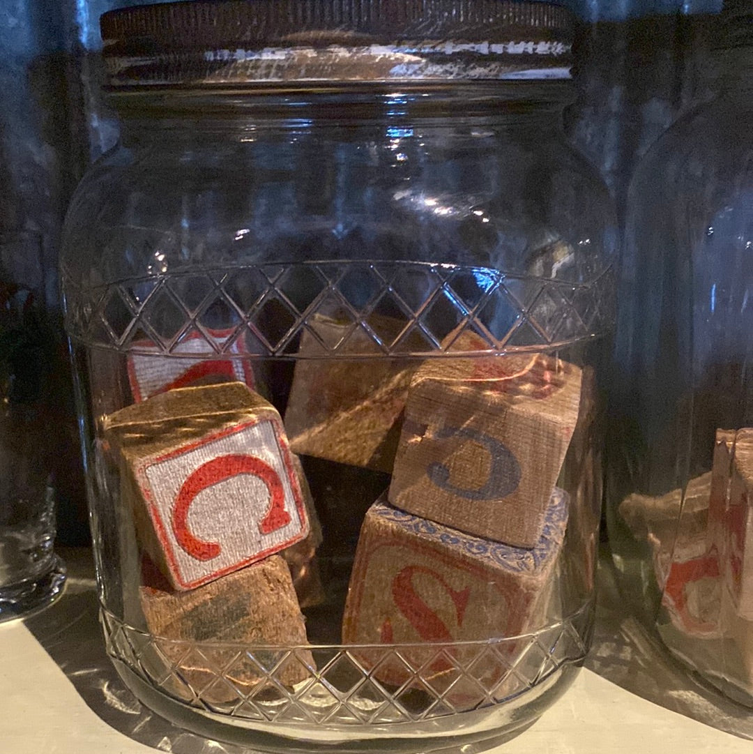 3 lg jars with blocks