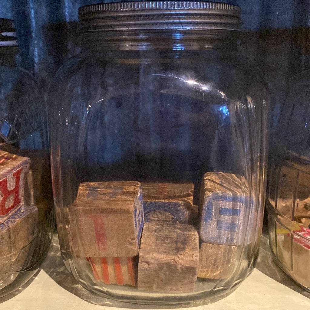 3 lg jars with blocks