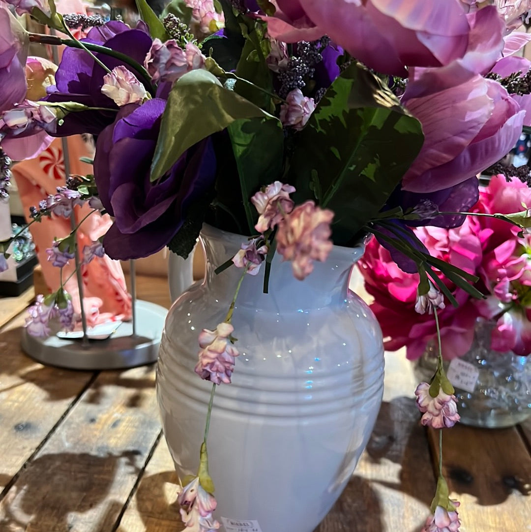 Fake flowers and white jar